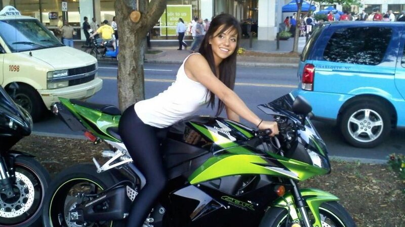 Woman on green motorcycle