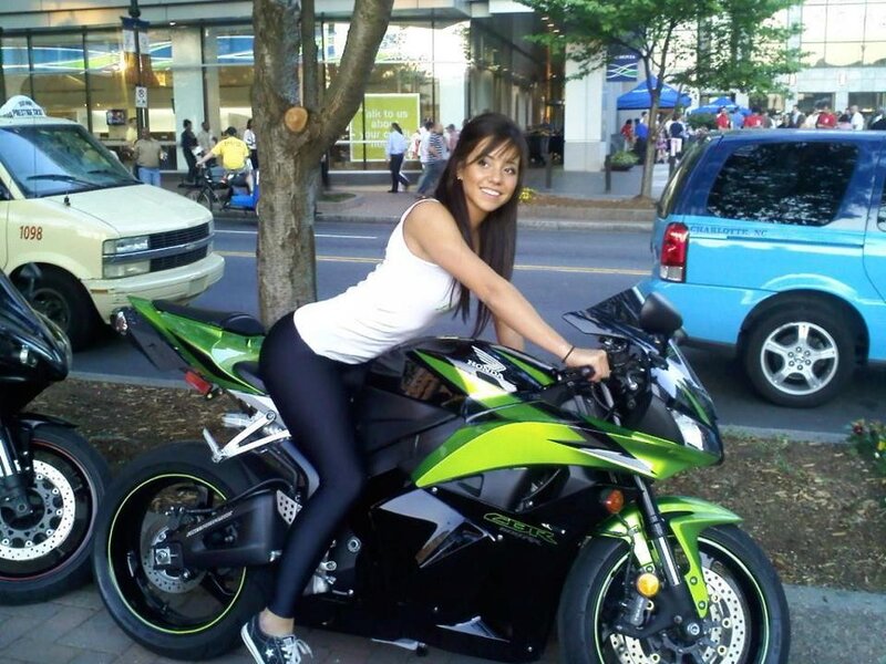 Woman on green motorcycle