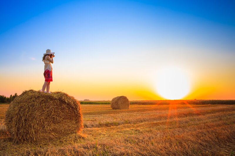 Woman on Hay Bale — Blue