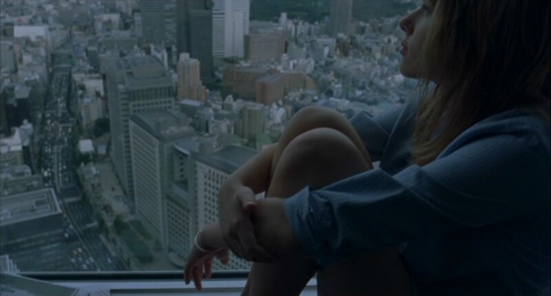 woman on high-rise window