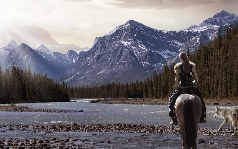Woman on horse by river
