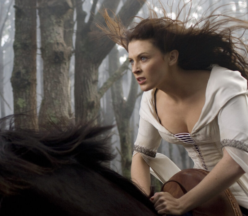 Woman on horse in forest