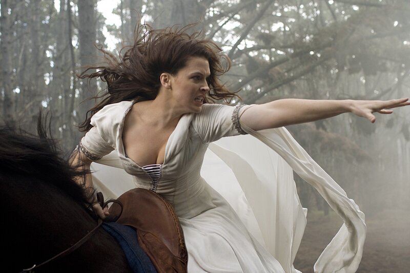 Woman on horse in forest