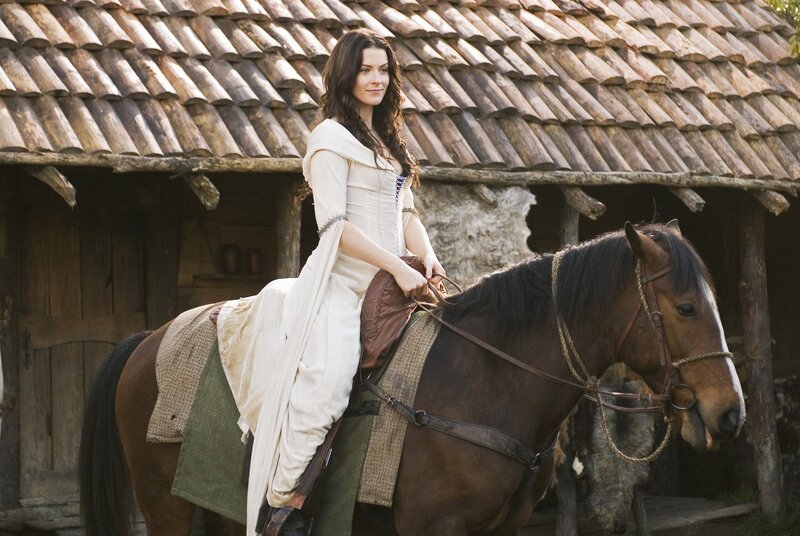 Woman on horse in medieval setting
