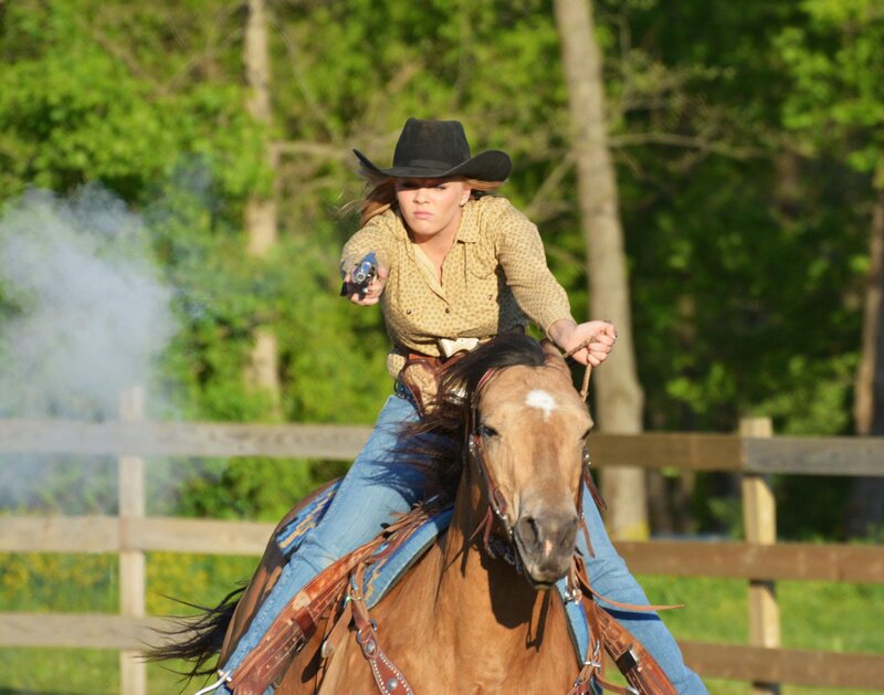 Woman on Horse with Gun