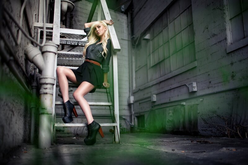 woman on industrial ladder