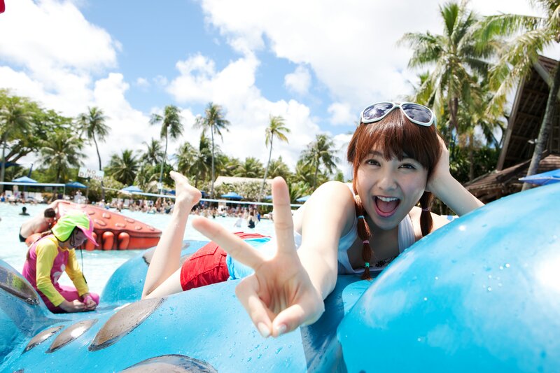 Woman on Inflatable Float — Blue, Joyful