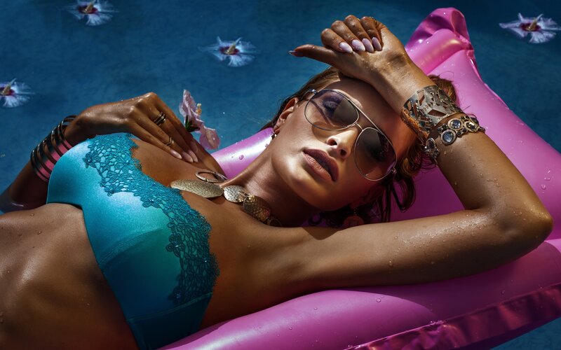 Woman on Inflatable Float — Blue, Relaxed, Afternoon