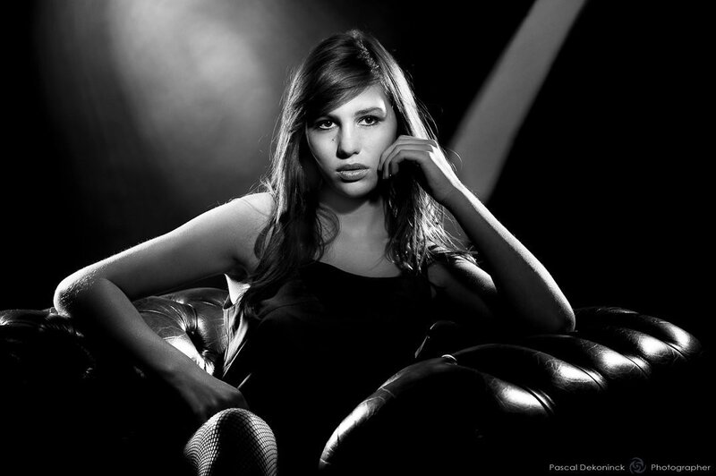 Woman on Leather Couch — Black, Dramatic, Photograph, Leather Couch, Fishnet Stockings