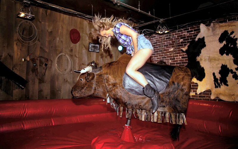 Woman on Mechanical Bull — Red, Playful