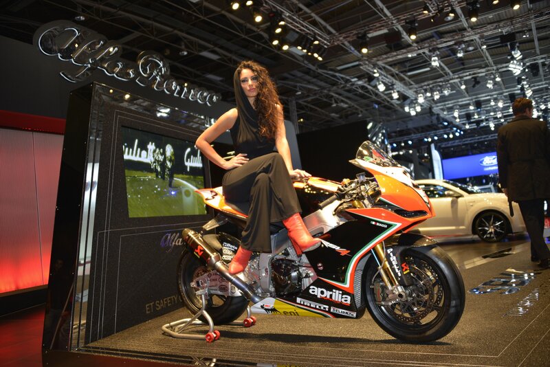 Woman on motorcycle at auto show