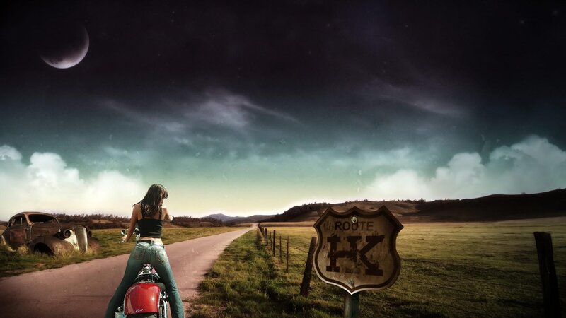 Woman on motorcycle at night