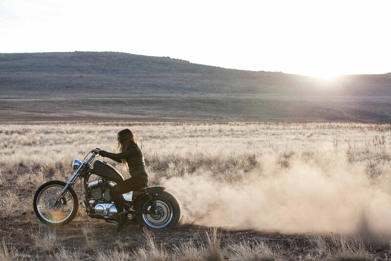 Woman on Motorcycle — Brown, Dramatic, Sunset, Photograph, Dust