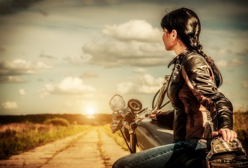 Woman on Motorcycle — Brown, Serene, Sunset
