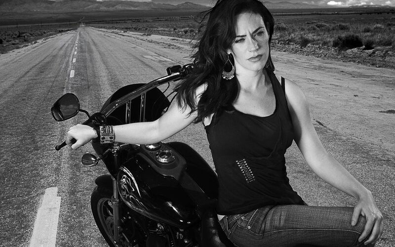 woman on motorcycle in desert