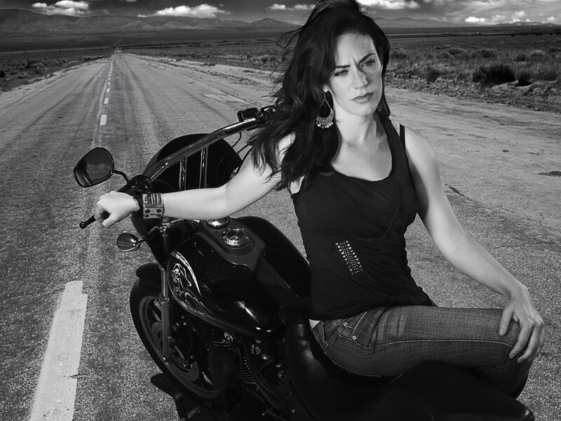 woman on motorcycle in desert