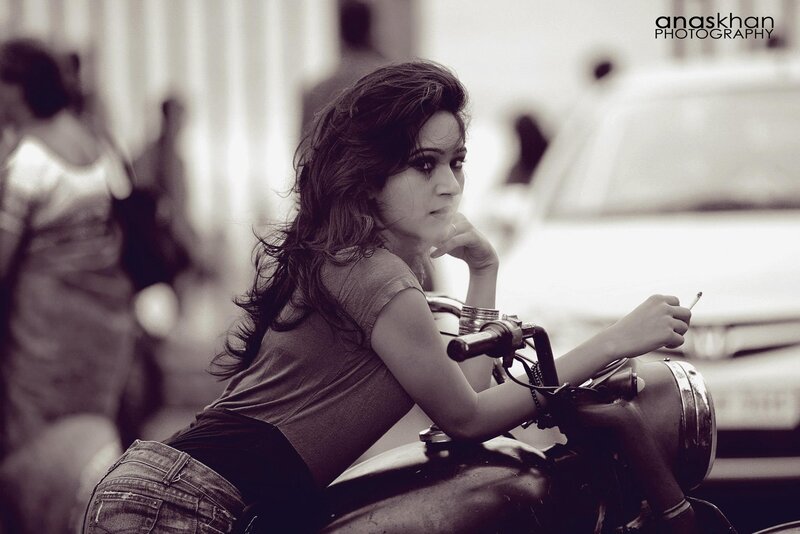 woman on motorcycle with cigarette