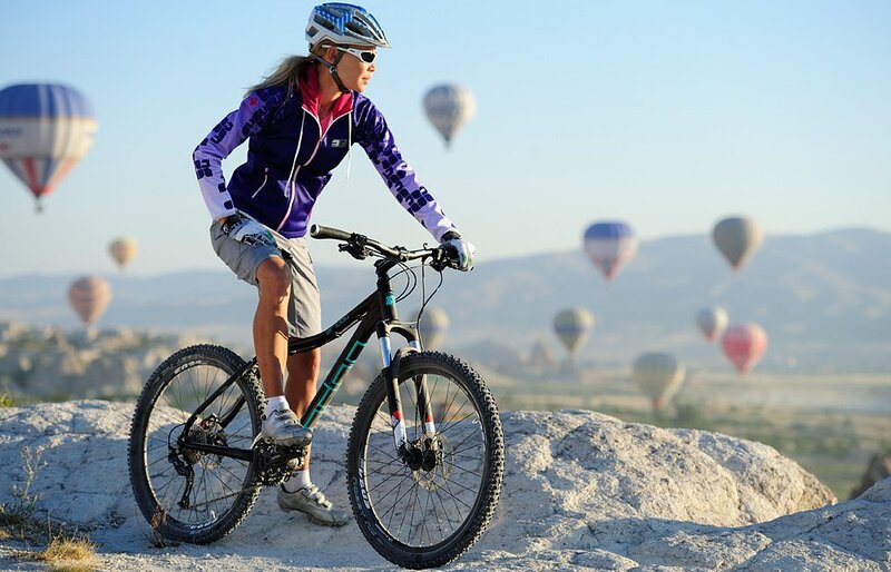 Woman on Mountain Bike — Blue