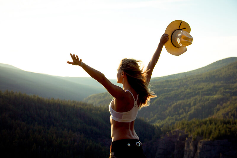 Woman on Mountain Peak — Green, Serene, Sunset