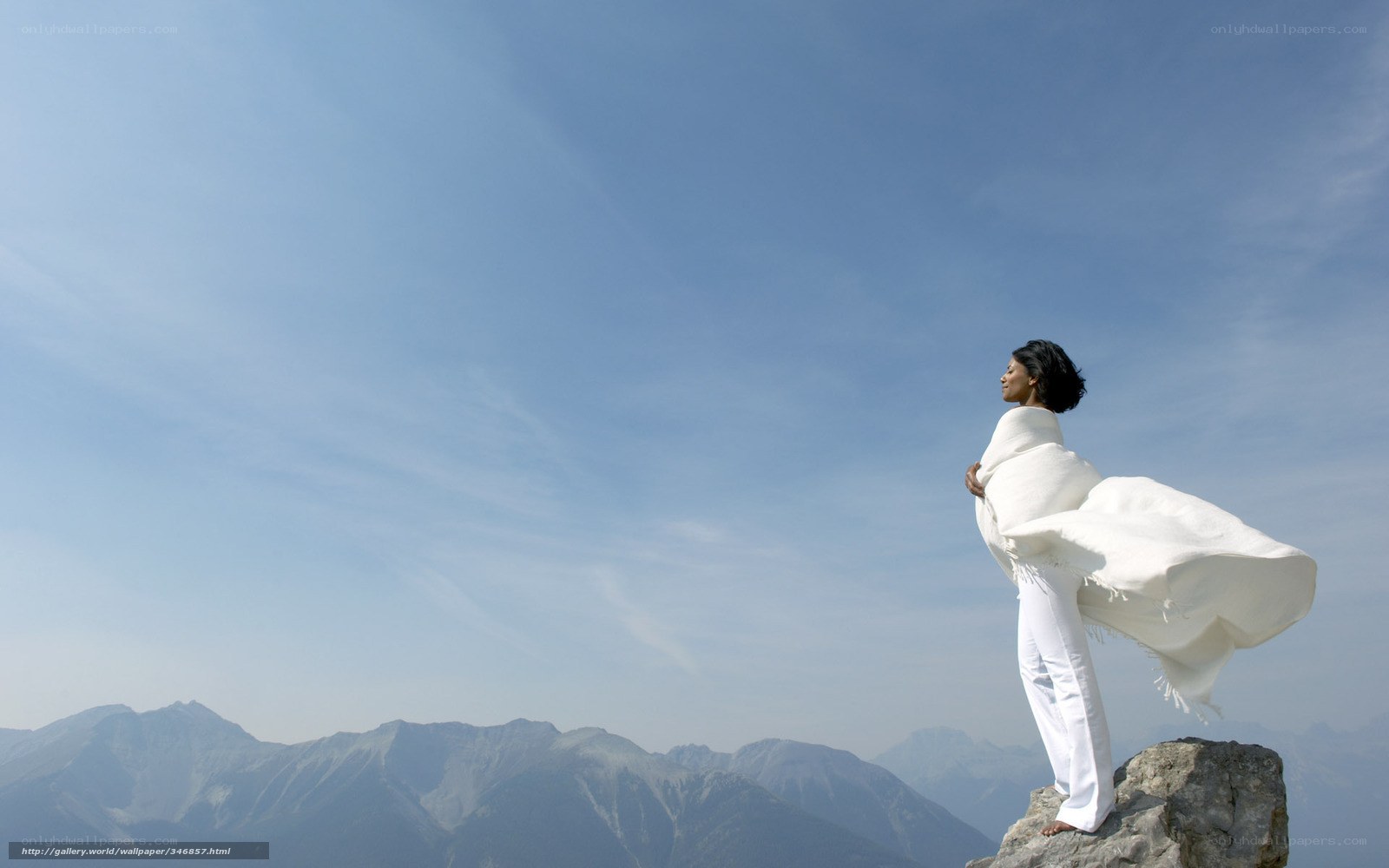 Woman on mountain peak