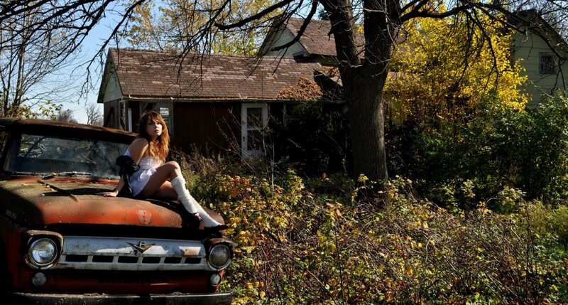 Woman on Old Truck — Brown, Dramatic