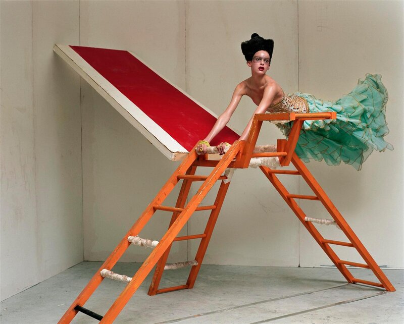 woman on orange ladder