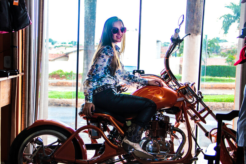 Woman on Orange Motorcycle — Relaxed