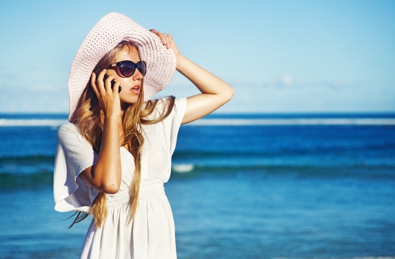 Woman on Phone at Beach — Blue