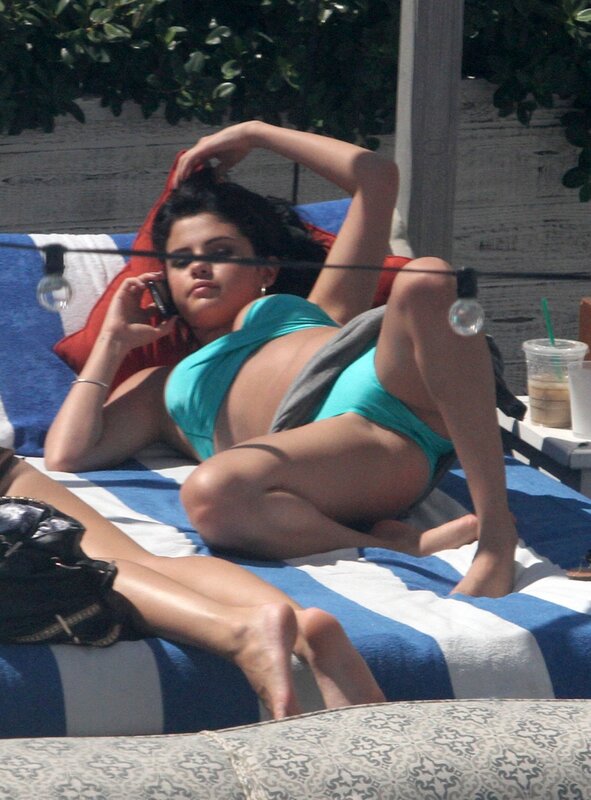 Woman on phone at pool