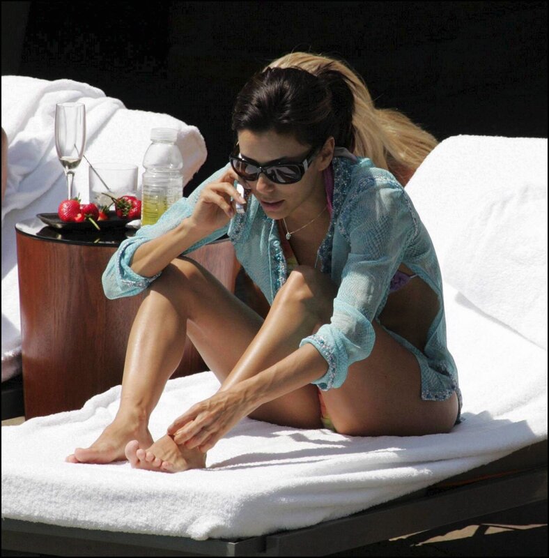woman on phone at pool