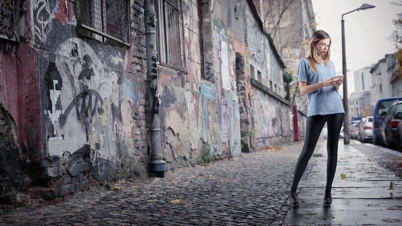 Woman on Phone in Alley — Gray, Urban