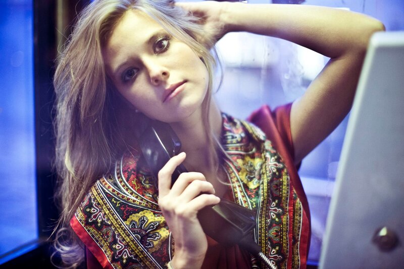 woman on phone in booth