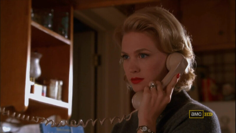 woman on phone in kitchen