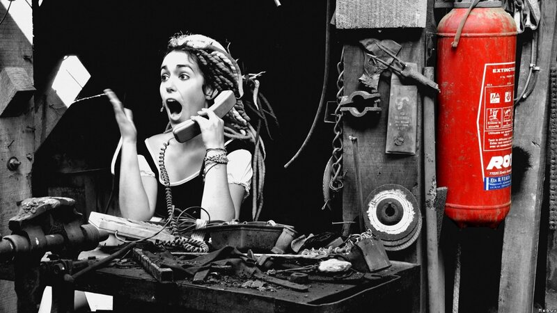 Woman on phone in workshop