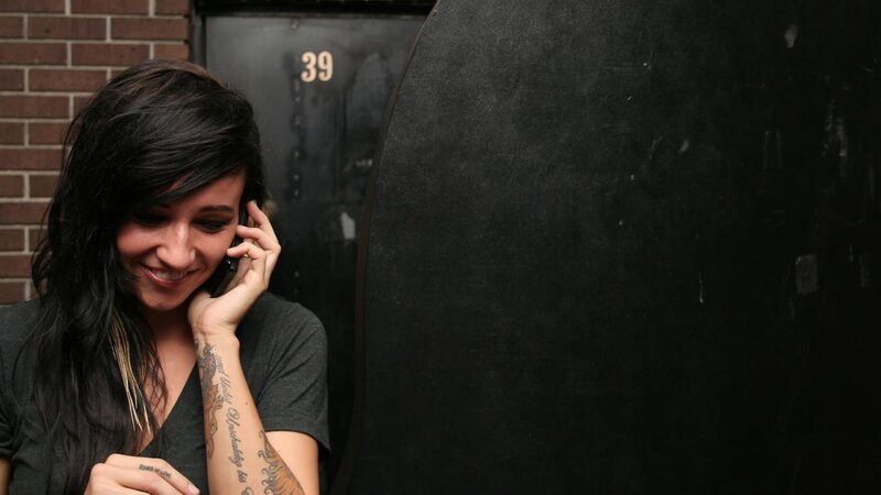 woman on phone smiling