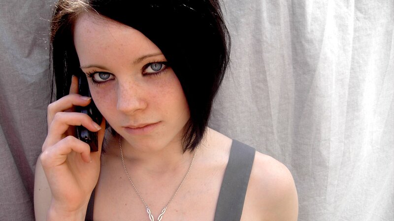 woman on phone with blue eyes