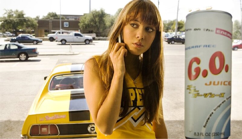 woman on phone with energy drink