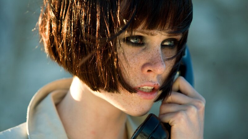 woman on phone with freckles