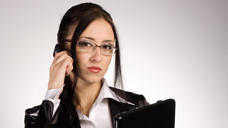 woman on phone with laptop