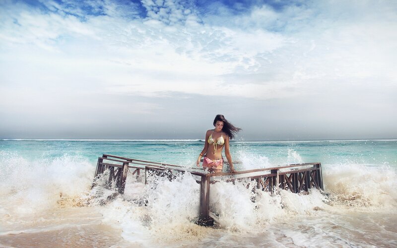 Woman on pier during storm