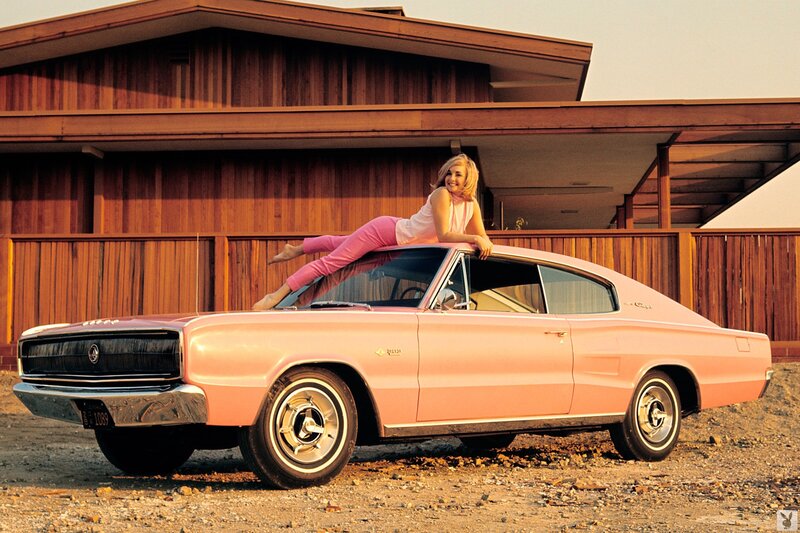 Woman on pink muscle car