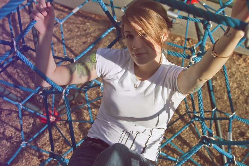 Woman on playground rope structure