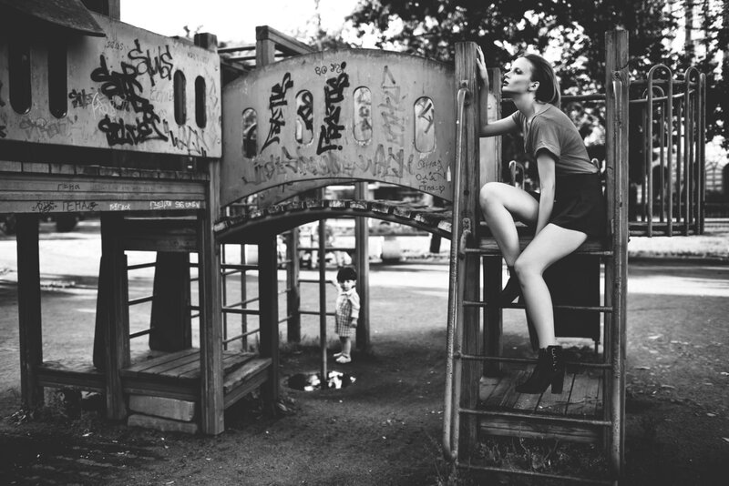 Woman on Playground Structure — Black