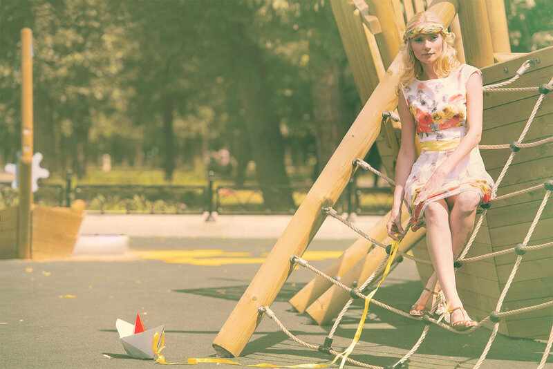 Woman on Playground Structure — Yellow