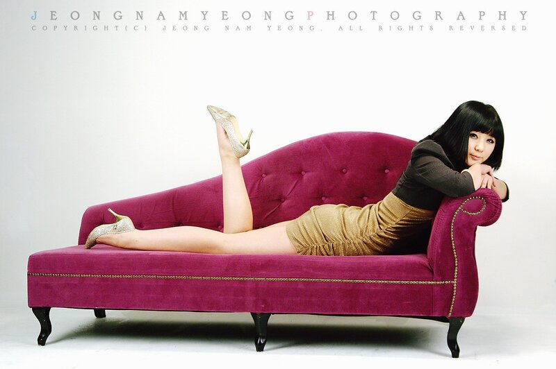 woman on purple chaise lounge
