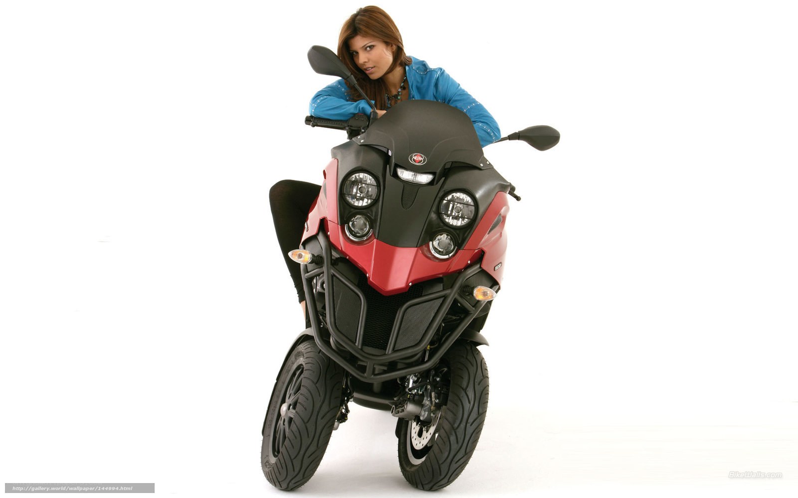 woman on red and black scooter