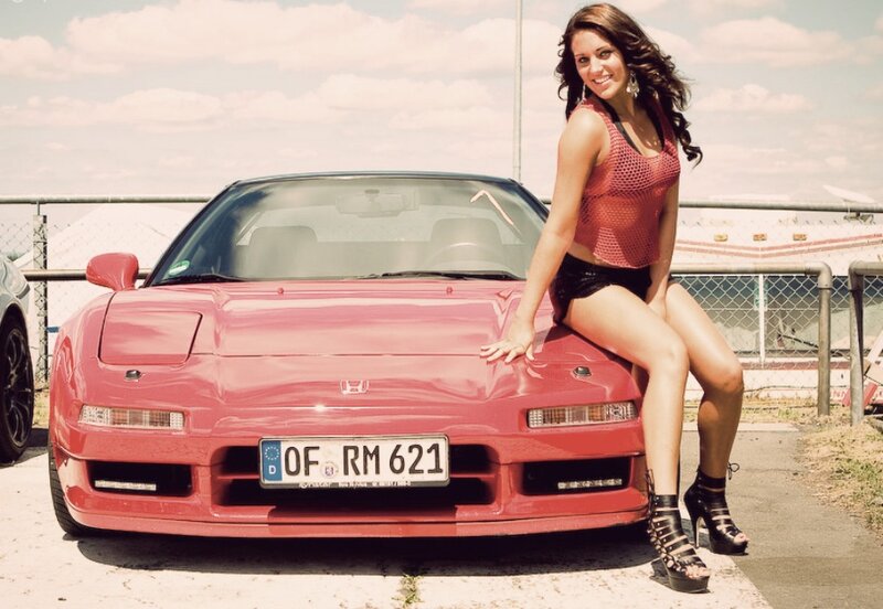 Woman on Red Car — Confident, Afternoon, Photograph