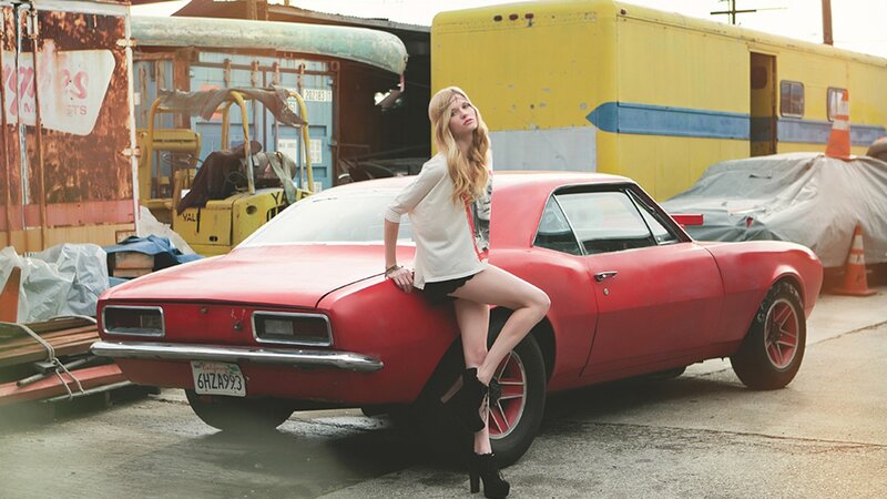 Woman on Red Car — Dramatic, Afternoon, Photograph, Truck