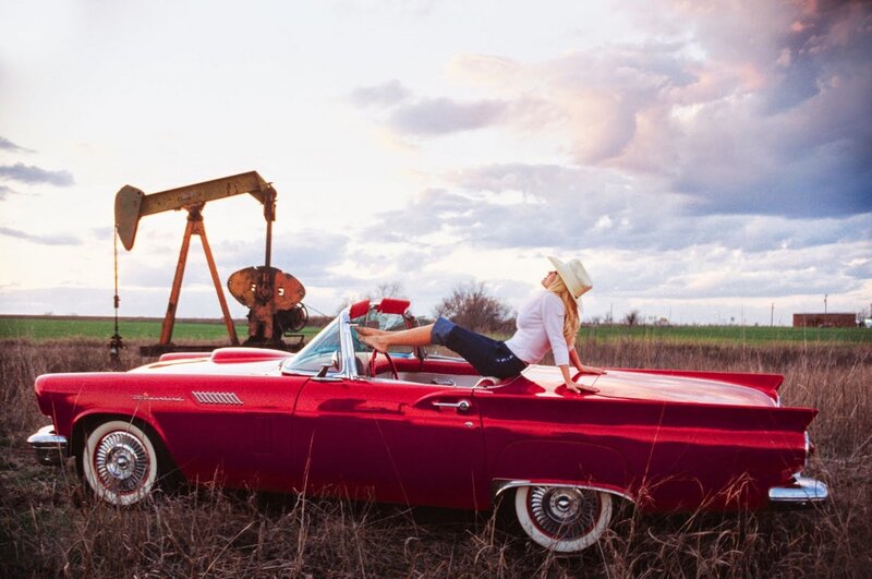 Woman on Red Car — Dramatic, Sunset