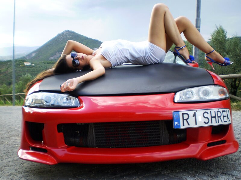 Woman on Red Car — Relaxed, Afternoon